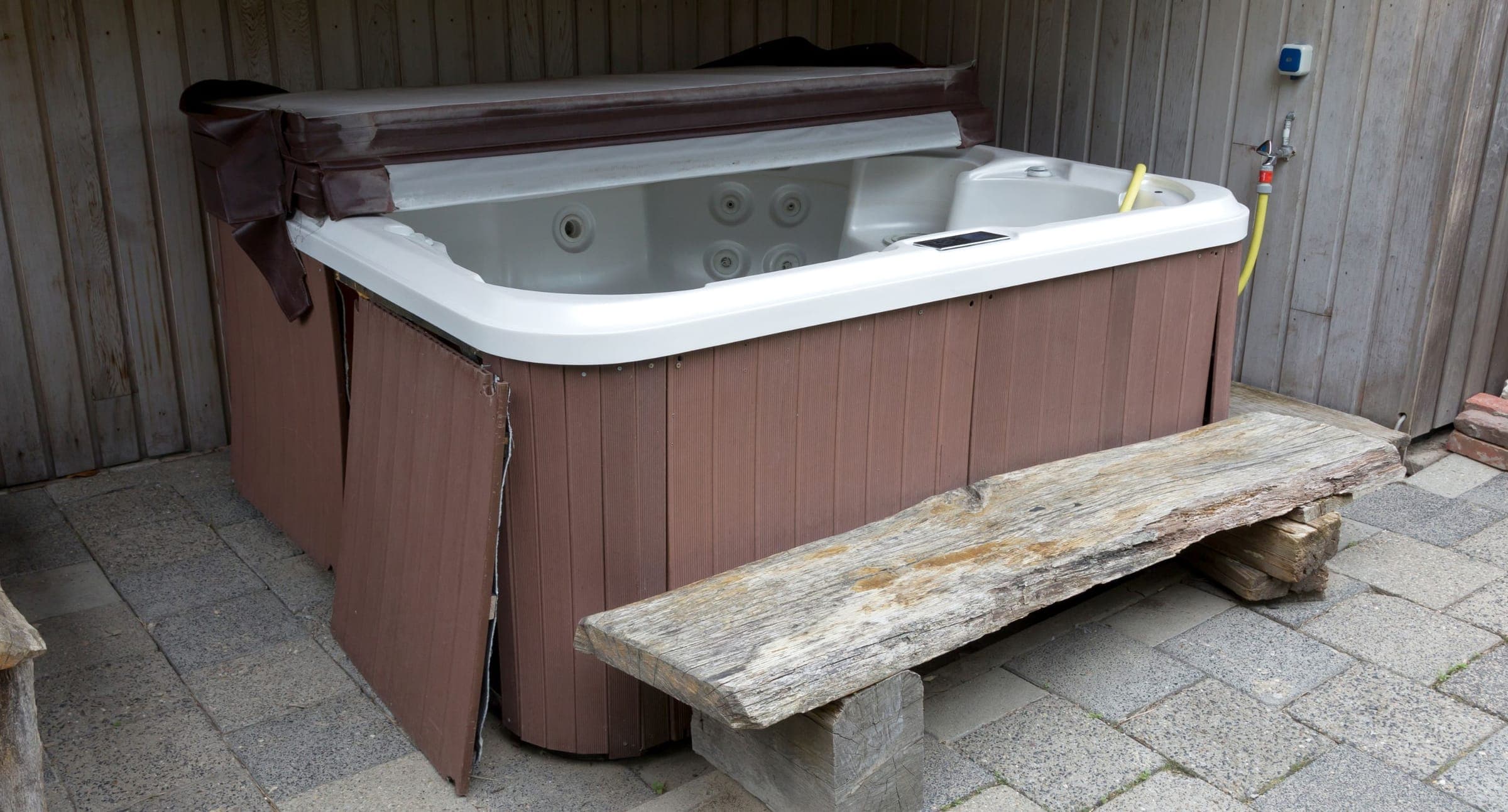 Covered hot tub after winterization, late fall