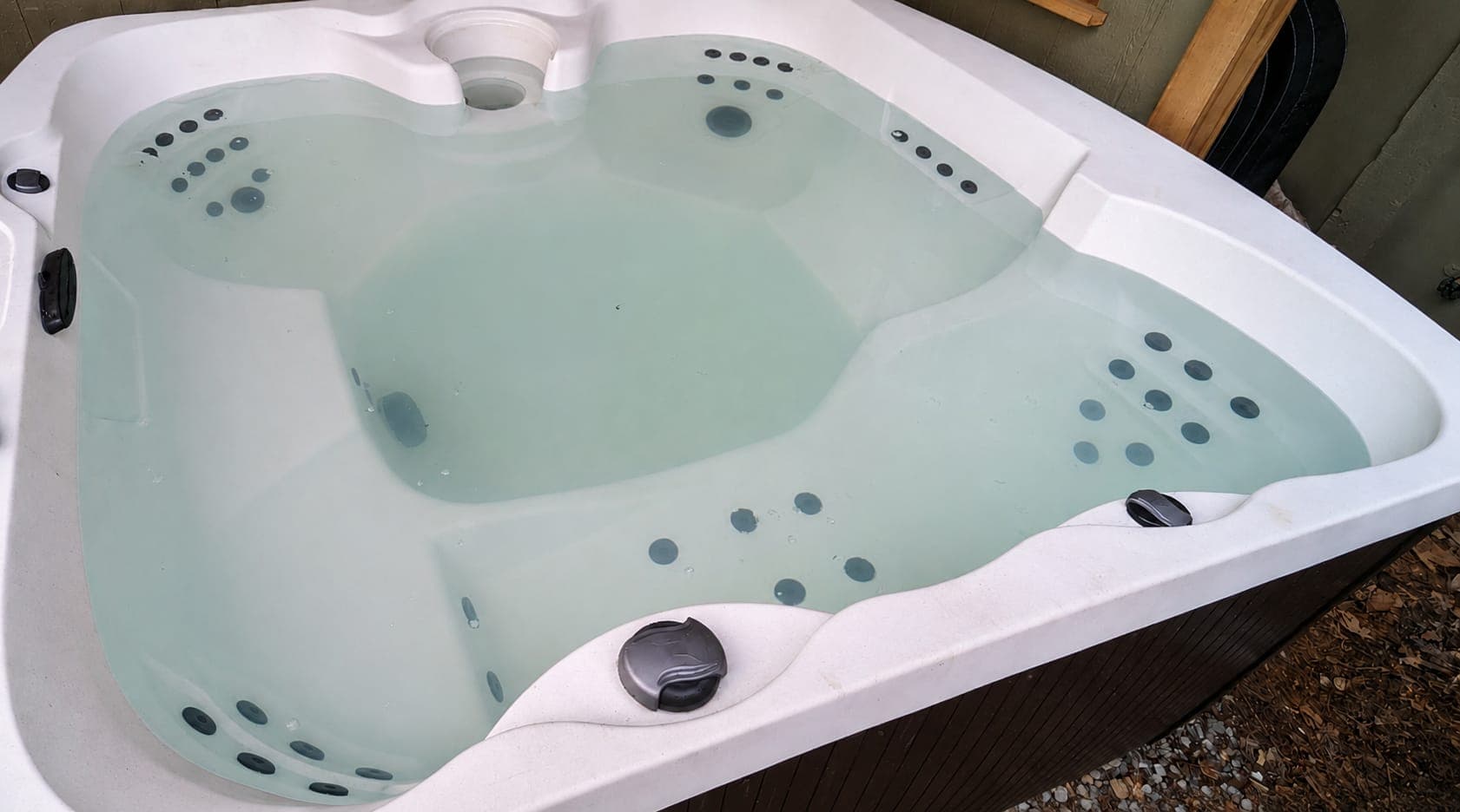 Cloudy hot tub water before a drain and deep clean