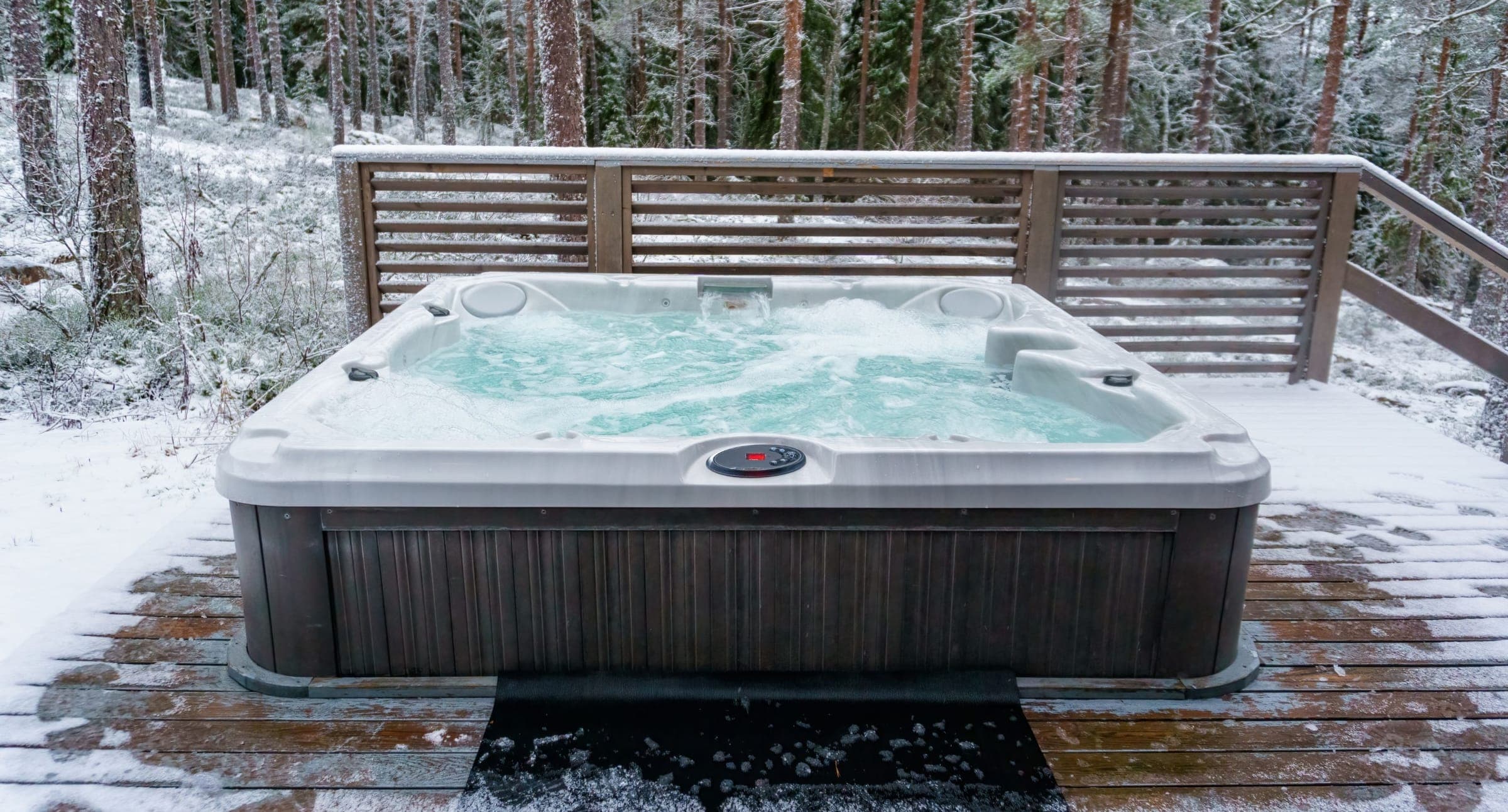Tech testing and balancing hot tub water on a weekly visit