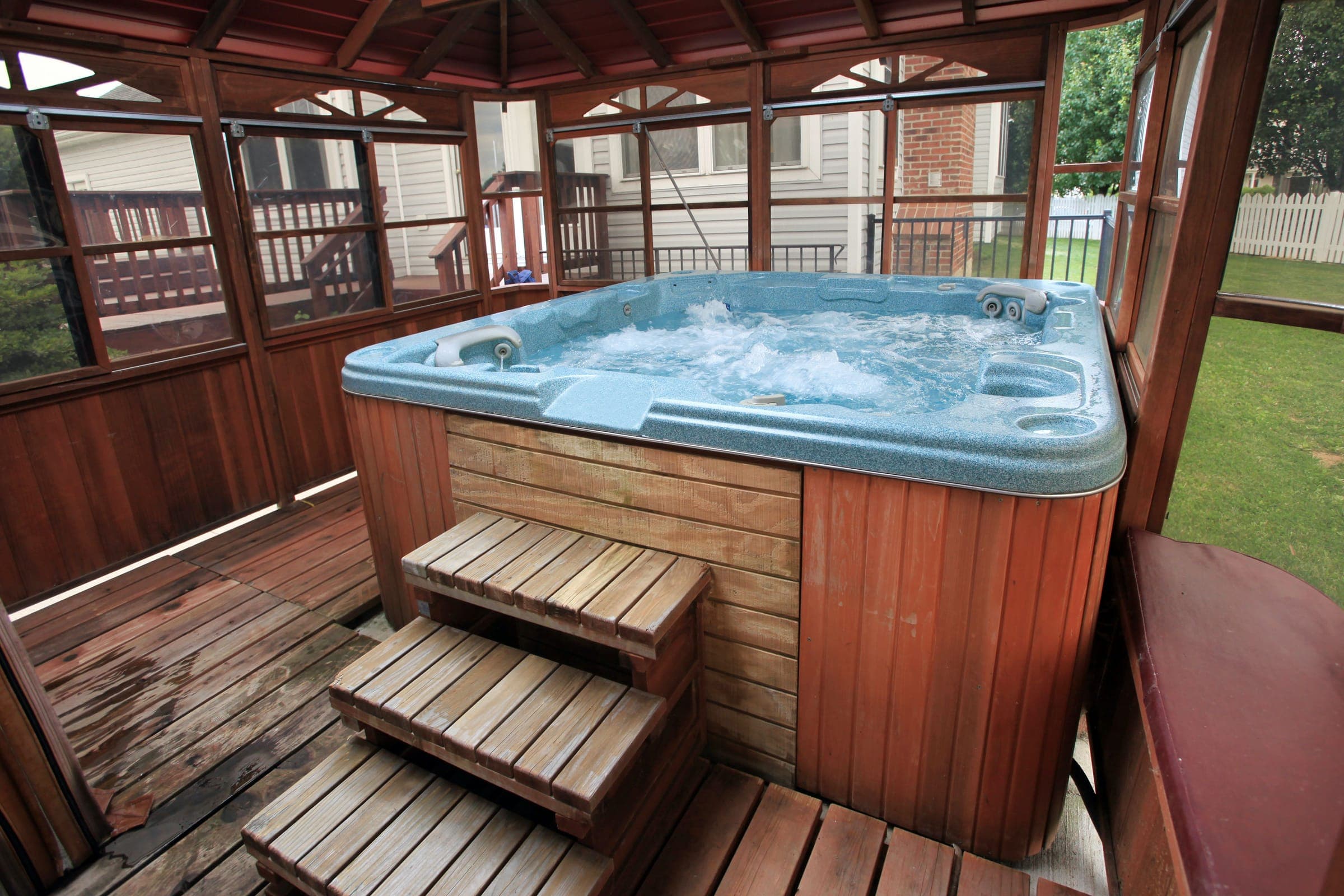 Clean refilled hot tub with clear water, ready to soak